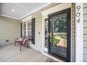 Close up of front door with glass and bench on porch at 904 E Ivy Valley Dr, Fuquay Varina, NC 27526
