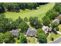 Stunning aerial view of a home backing onto a lush golf course providing serene natural views at 904 Parkridge Dr, Clayton, NC 27527