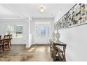 Bright foyer featuring wood floors, high ceilings, and elegant console table at 93 Kinsale Ct, Garner, NC 27529