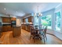 Eat-in kitchen with stainless appliances, center island, plenty of cabinet space, and an abundance of natural light at 10625 Soma Ct, Raleigh, NC 27613
