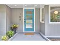 A closer view of the front door featuring its unique design and modern hardware at 108 Cedar St, Chapel Hill, NC 27514