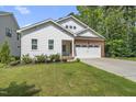 Charming single-Gathering home with a well-manicured lawn and a brick and siding facade at 112 Lager Ln, Garner, NC 27529