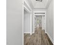 Bright hallway with wood floors, white trim, and high ceilings that creates an inviting space at 112 Lager Ln, Garner, NC 27529