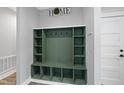 Functional mudroom featuring a custom built-in storage unit and a coat rack at 112 Lager Ln, Garner, NC 27529