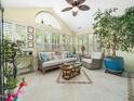 Bright sunroom with tile flooring, vaulted ceiling, and plenty of natural light at 1167 Blue Bird Ln, Wake Forest, NC 27587