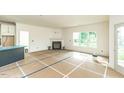 Spacious living room with fireplace, neutral walls, and large windows for natural light at 1229 Lawndale Dr, Graham, NC 27253