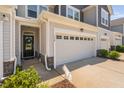 Close up view of a townhome's entrance and garage at 150 Gosford Ln, Garner, NC 27529