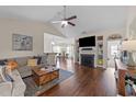 Cozy living room features a ceiling fan, fireplace, and open layout for comfortable living at 16 Woodglen Dr, Clayton, NC 27527