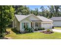 Charming single-Gathering home with manicured lawn and inviting curb appeal, a perfect blend of comfort and style at 174 Sequoia Dr, Louisburg, NC 27549