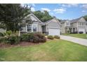 Attractive single-story home with a landscaped front yard and a two-car garage at 3037 Willow Ranch Dr, Fuquay Varina, NC 27526