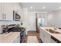 Well-appointed kitchen featuring modern appliances, ample counter space, and stylish cabinetry at 3113 Vitner Dr, Durham, NC 27704