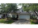 Charming two-story home featuring a two-car garage and beautifully landscaped front yard at 3423 Van Hessen Dr, Raleigh, NC 27614