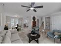 Bright living room with open concept and elegant furnishings at 403 Carpenter Fletcher Rd, Durham, NC 27713