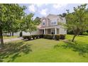 Inviting two-story home featuring a well-maintained lawn and classic architectural details at 4205 Twin Spires Dr, Knightdale, NC 27545