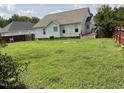 Spacious backyard with a deck and a lush green lawn, perfect for outdoor entertaining at 44 Glen Meadow Dr, Angier, NC 27501