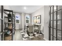 Stylish home office with neutral walls, bright windows, and ample shelving at 612 Sweet Iris Dr, Knightdale, NC 27545