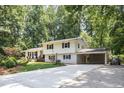 Charming two-story home with a covered carport and long driveway at 6609 Electra Dr, Raleigh, NC 27607