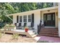 Inviting front porch with seating, creating a cozy and welcoming entrance to the home at 6609 Electra Dr, Raleigh, NC 27607