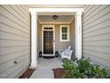 Inviting front porch with a swing, providing a cozy and welcoming entrance at 835 New Derby Ln, Apex, NC 27523