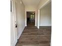 The foyer offers a view of the living room with a fireplace and large windows at 111 Hot Springs Way, Benson, NC 27504