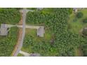 Aerial view of a home surrounded by lush trees in a quiet neighborhood at 1210 Bayview Ct, Franklinton, NC 27525