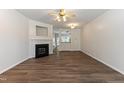 Cozy living room boasts a fireplace and is open to the kitchen creating an inviting and connected space at 127 Cedar Elm Rd, Durham, NC 27713