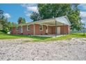 Rear view showing a carport and backyard at 1308 Tyson Loop Rd, Spring Hope, NC 27882