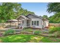 Charming home exterior featuring a cozy front porch, well-maintained landscaping and inviting stone walkway at 2503 Shirley St, Durham, NC 27705