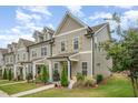 Attractive townhouses with tidy front yards and inviting entryways, creating curb appeal at 321 Conrad Ln, Wake Forest, NC 27587