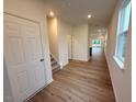 Bright entryway features wood-look floors and leads to the staircase and an open-concept living area at 507 Eastwood St, Durham, NC 27704