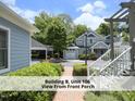 Condo building with lush landscaping and charming architectural details at 511 Hillsborough St # Bldg B 106, Chapel Hill, NC 27514