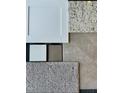 Material selections showcasing the color palettes and material options for kitchen and bathroom finishes at 522 Olivia Crossing Ct # 18, Four Oaks, NC 27524