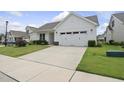 Attractive one-story house with neat landscaping and an attached two-car garage at 537 Bramble Ln, Clayton, NC 27527