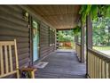 Inviting front porch with rocking chairs, a swing, and a welcoming atmosphere at 5593 Leon Rd, Nashville, NC 27856