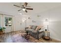 Inviting living room featuring stylish sofa, elegant lighting, and a vibrant area rug at 7002 Longstreet Dr # C, Raleigh, NC 27615