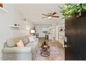 Cozy living room featuring stylish gray sofa, soft pink pillows, and chic accent tables at 7002 Longstreet Dr # C, Raleigh, NC 27615