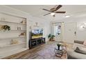 Bright living room boasts built-in shelving, contemporary decor, and a comfortable seating area at 7002 Longstreet Dr # C, Raleigh, NC 27615