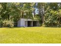 Exterior view of a large storage shed in the backyard of the property, providing extra storage space at 7595 Clayton Blvd # B, Clayton, NC 27520