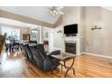 Comfortable living space boasting a fireplace, hardwood floors, and a view to other rooms at 8101 Claybrooke Ct, Willow Springs, NC 27592