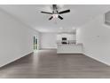 Open-concept living space with recessed lighting, kitchen view, and access to the patio at 104 Flue Ct, Oxford, NC 27565