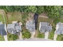 An overhead view of the houses on a tree lined street with spacious green lawns at 1144 Dexter Ridge Dr, Holly Springs, NC 27540