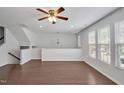 Bright living room boasting hardwood floors, large windows, and an open layout at 1434 Salem Dr, Apex, NC 27502