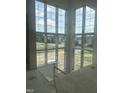 Large windows overlook the property, inviting an abundance of natural light into this stunning new home at 1531 Salem Church Rd, Apex, NC 27523