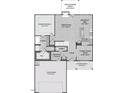 Layout of the first floor features primary bedroom, open living area, kitchen, and two-car garage at 20 Malbec Way, Youngsville, NC 27596