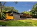 Charming mid-century home with well-maintained lawn and covered parking at 2129 Ridge Rd, Raleigh, NC 27607
