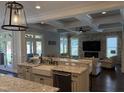 Open kitchen with granite countertops, stainless steel appliances, and an island with seating at 2725 Belmont View Loop, Cary, NC 27519