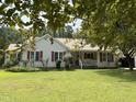 Charming single-story home with a welcoming front porch and well-maintained landscaping at 3000 Hidden Spring Ln, Oxford, NC 27565