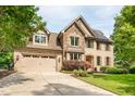 Beautiful brick home featuring stone accents, an attached garage, and a manicured front yard at 429 Carolina Cir, Durham, NC 27707
