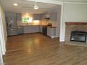 Modern kitchen with gray cabinetry, butcher block countertops, stainless steel appliances and wood look flooring at 440 Montgomery Rd, Franklinton, NC 27525
