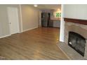 Open concept living space with fireplace, seamlessly connecting to the modern kitchen with stainless steel appliances at 440 Montgomery Rd, Franklinton, NC 27525